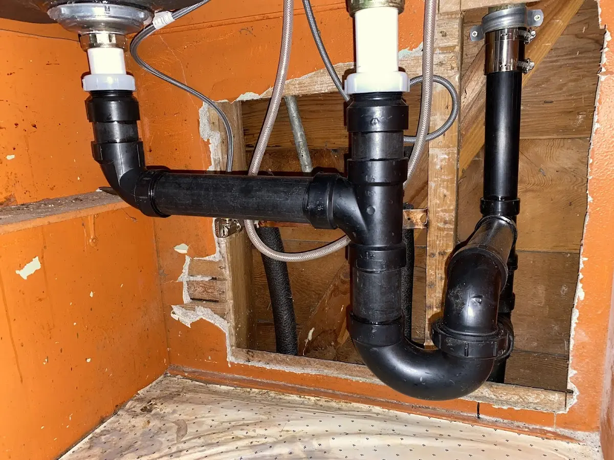 Professional Garbage Disposal Repair equipment and tools on the job in Fair Haven